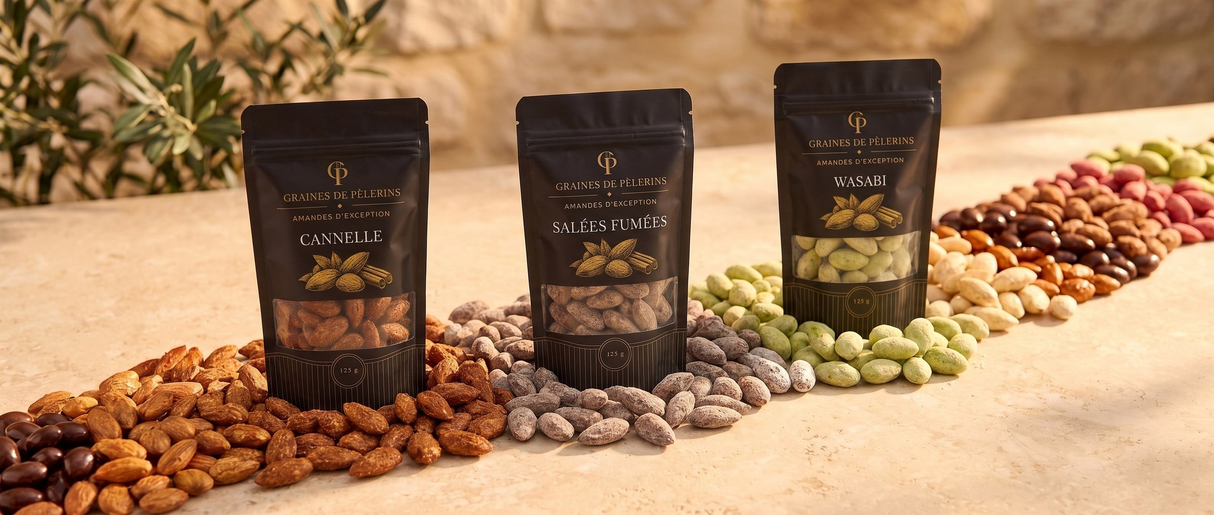 Bannière collection Amandes d'Exception, rivière d'amandes longues effilées Cannelle, Salées Fumées et Wasabi, sachets Graines de Pèlerins